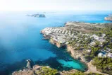 Aerial view of a town on a rocky island on 12-18 Investment Management GmbH website.